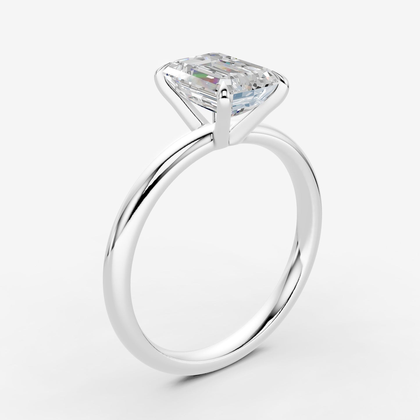 Classic Emerald Solitaire Ring in 18K White Gold