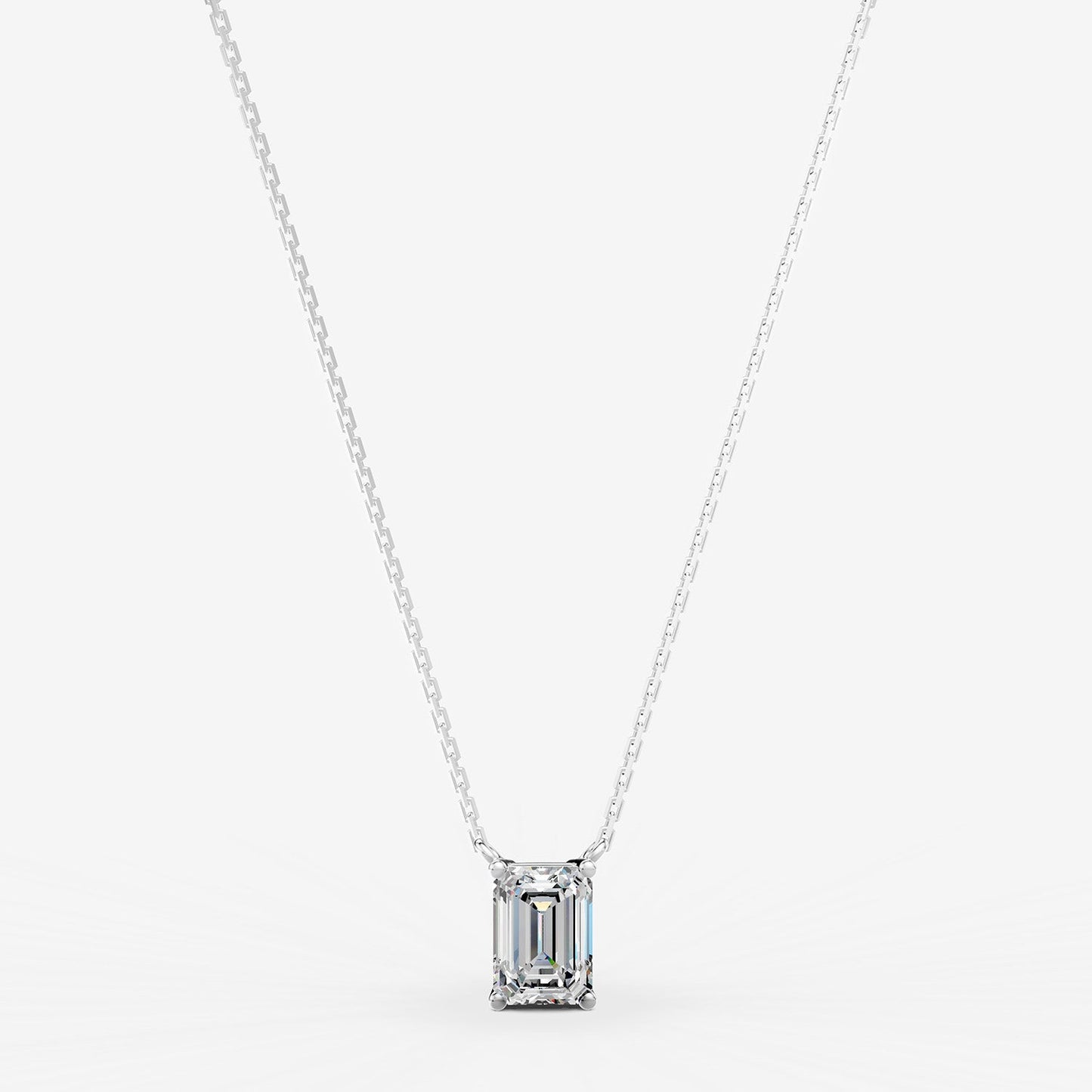 Classic Emerald Solitaire Pendant in 18K White Gold