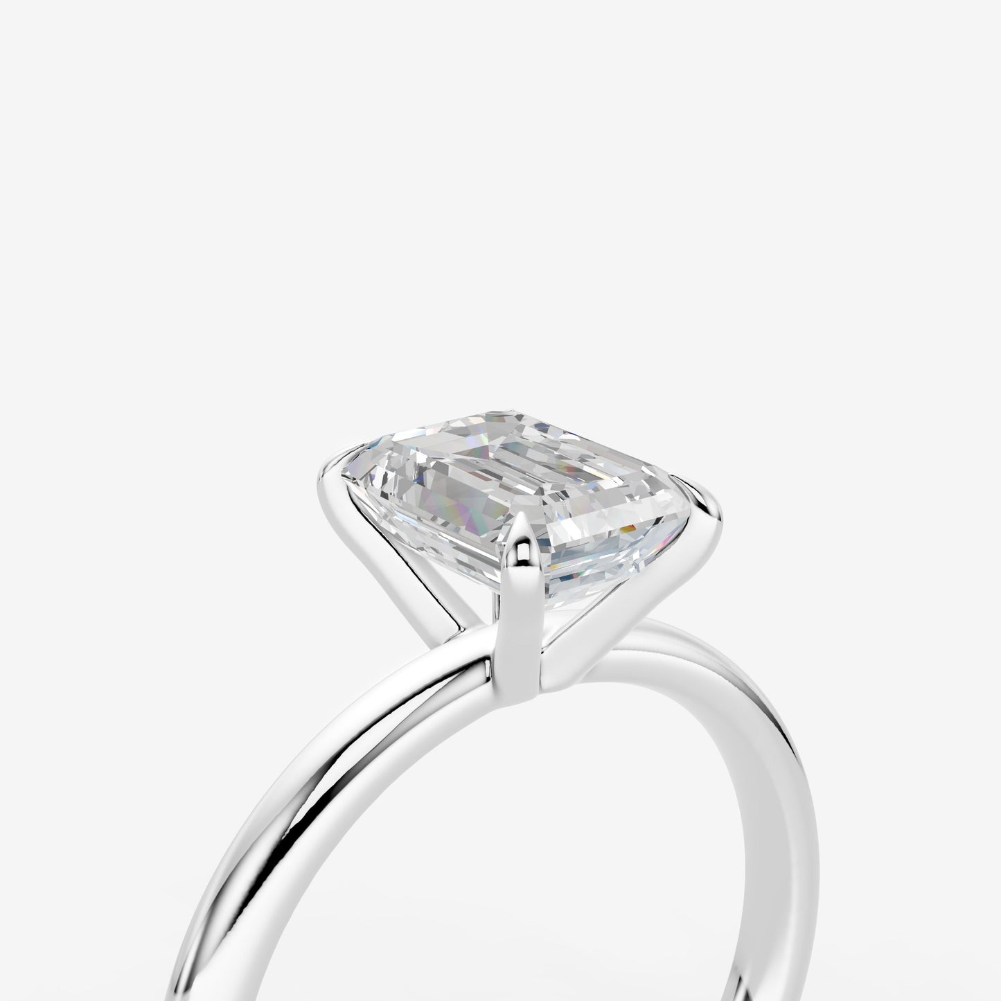 Classic Emerald Solitaire Ring in 18K White Gold