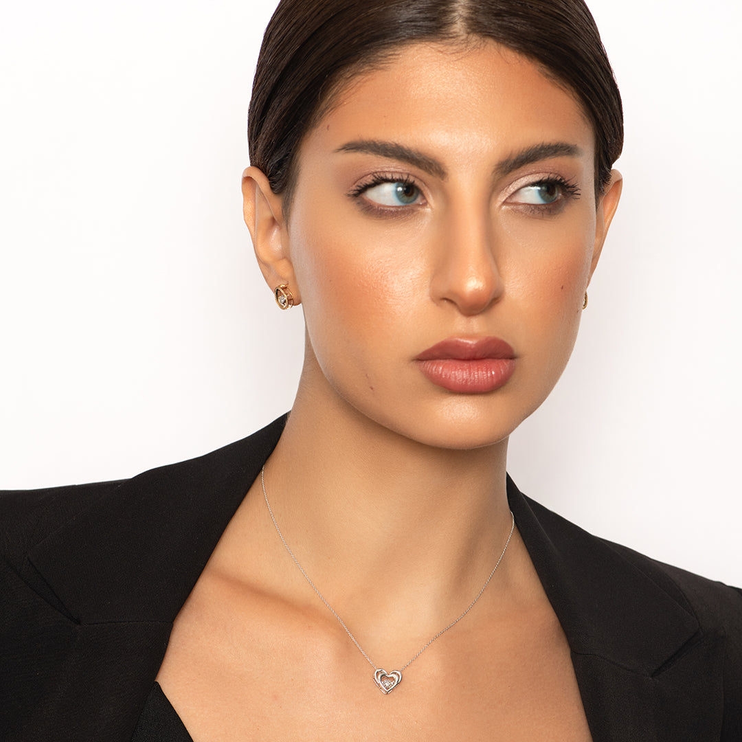 Twin Heart Pendant with dancing Diamond