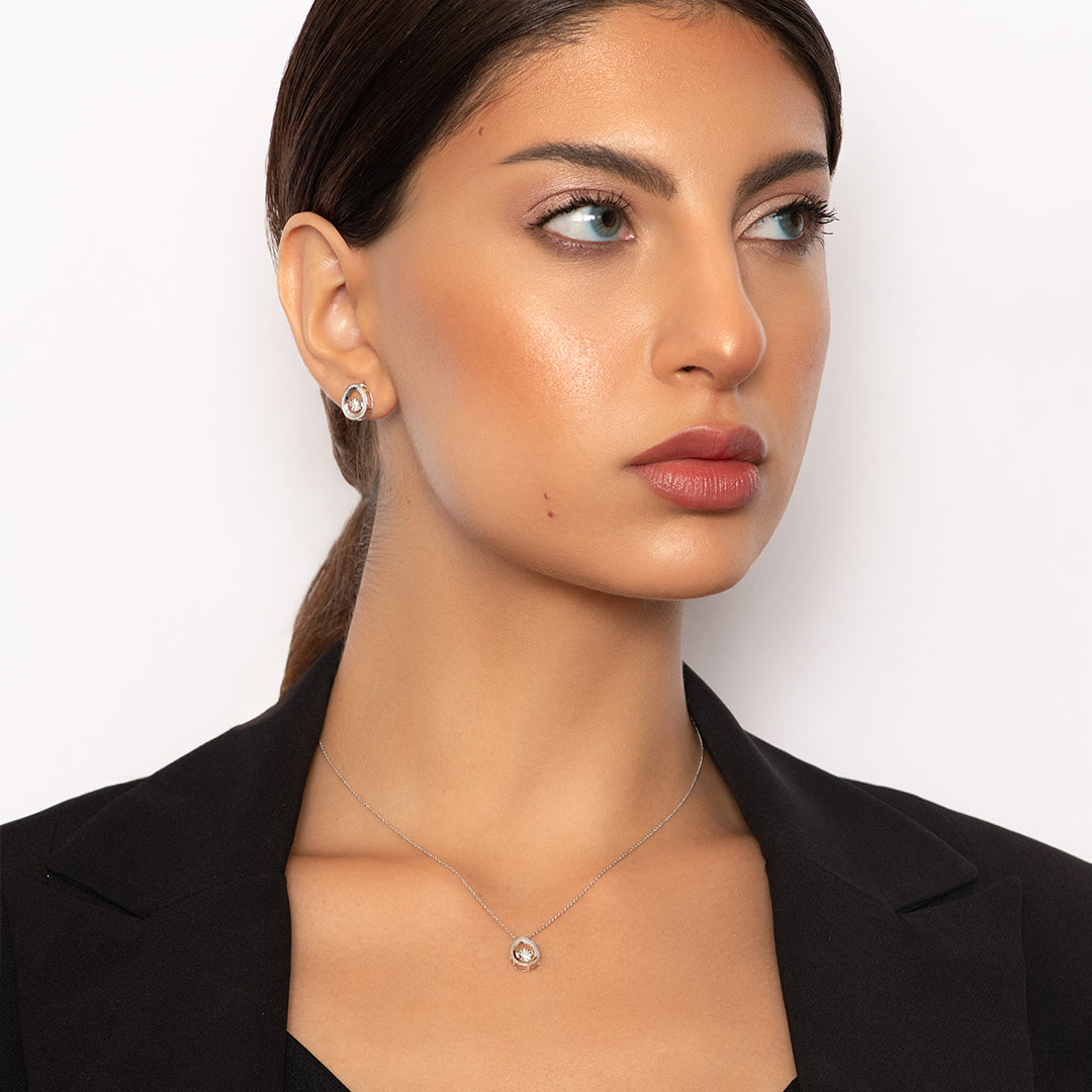 Delicate Oval Pendant with dancing Diamond and chain in 18K White Gold