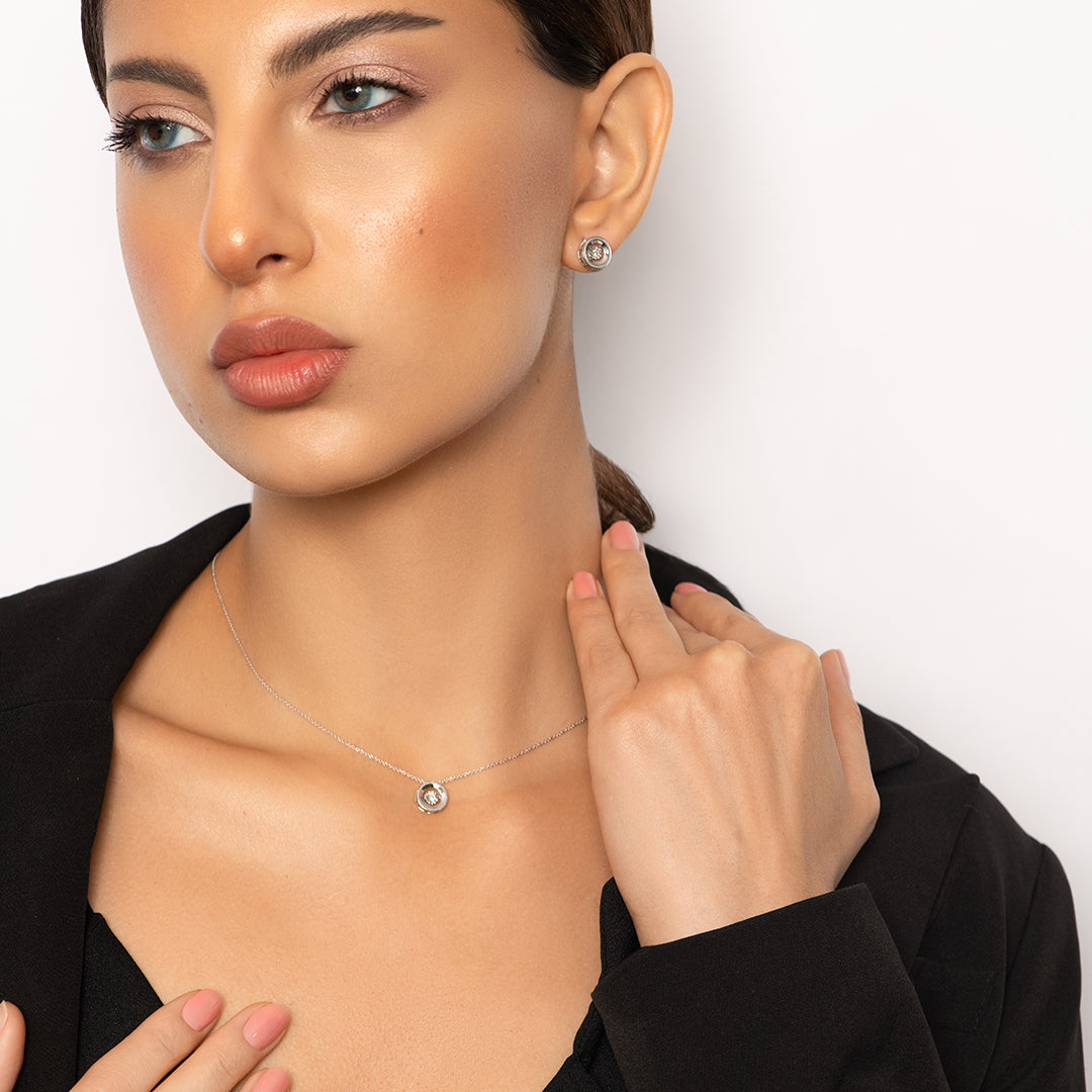 Delicate Round Pendant with dancing Diamond and chain in 18K White Gold