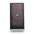 Delicate Oval Pendant with dancing Diamond and chain in 18K Yellow Gold