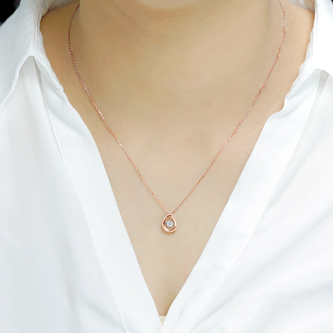 Delicate Oval Pendant with dancing Diamond and chain in 18K Rose Gold